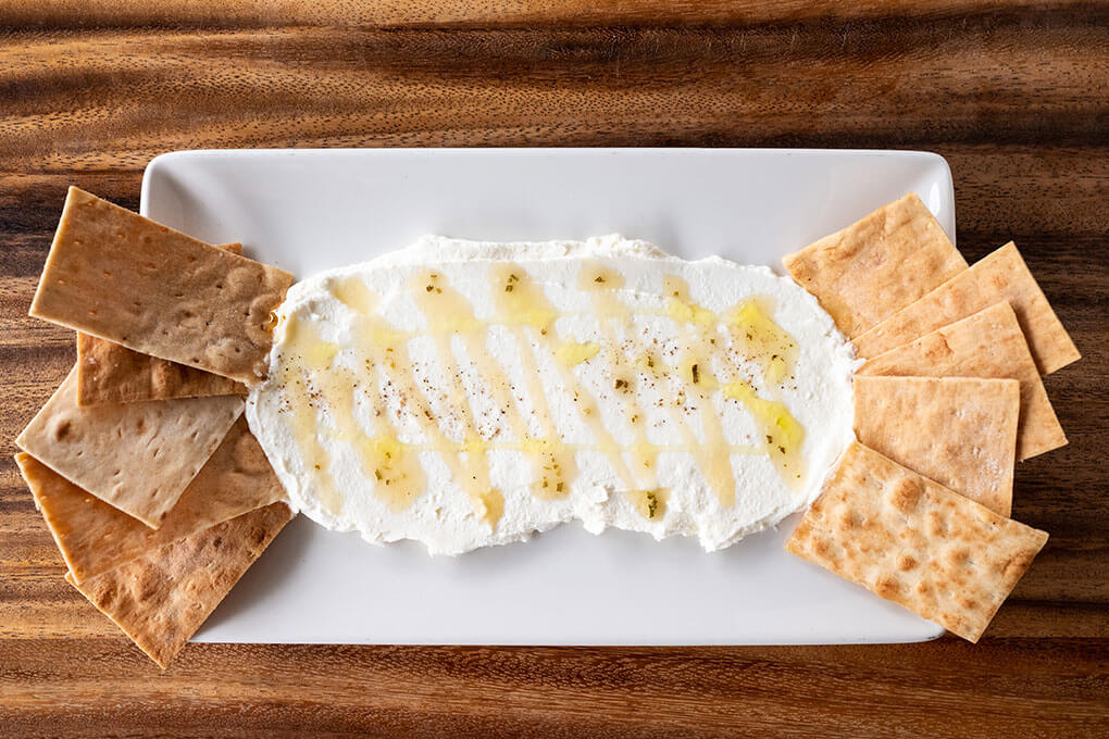 Housemade Ricotta with olive oil and rosemary honey, served with lavosh