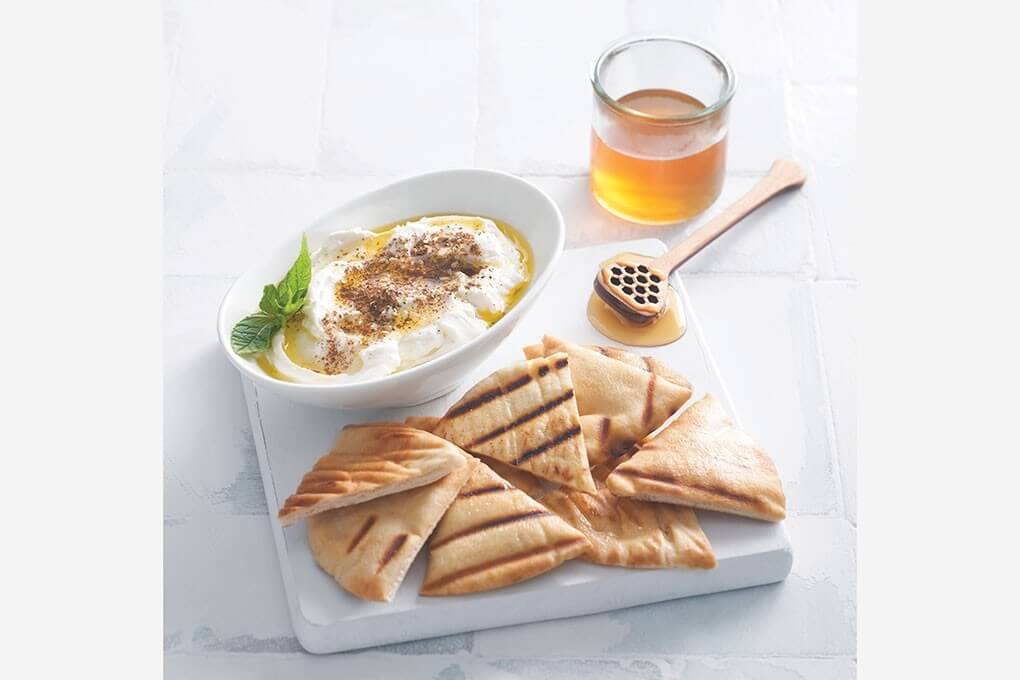 Lebanese Labneh Dip with za’atar-spiced honey drizzle, served with honey-grilled pita