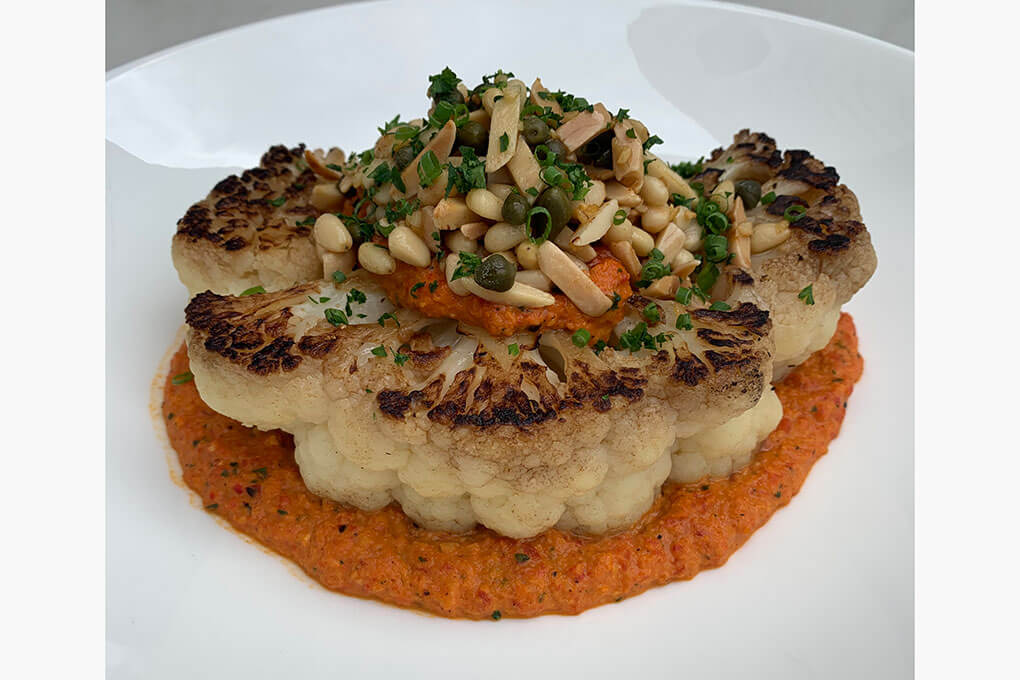 Roasted Cauliflower with romesco sauce, toasted almonds, pine nuts, garlic, capers, chives and parsley