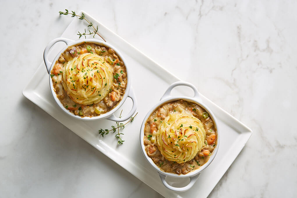 Braised Lentil & Vegetable Shepherd’s Pie with bourbon-braised lentils, portobello mushrooms, mashed potatoes and white cheddar