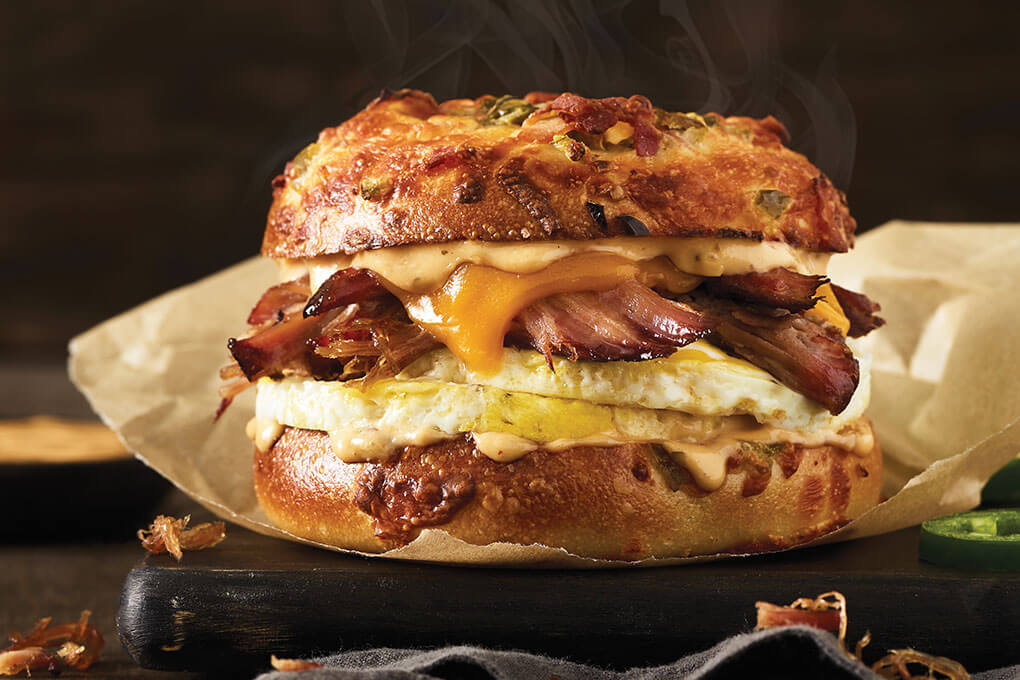 Cage-free fresh-cracked griddled eggs, smoked beef brisket and cheddar with smoky chipotle aïoli on a gourmet jalapeño-bacon bagel