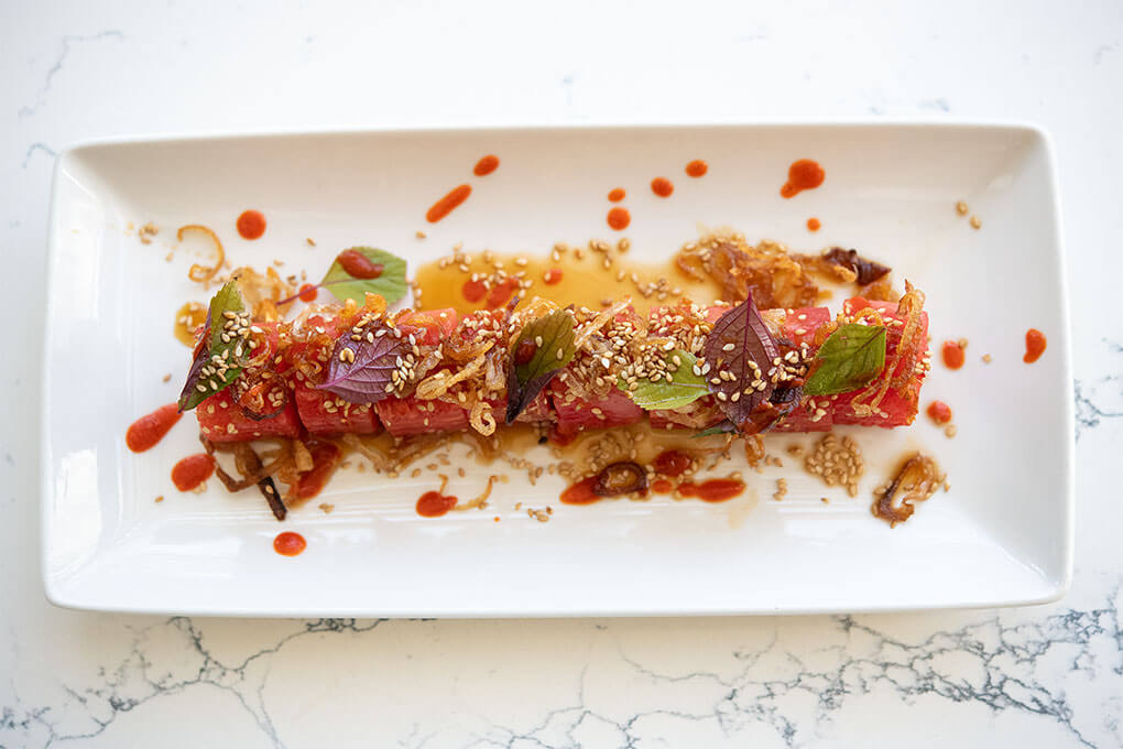 Watermelon sushi with fried shallots and lime dressing