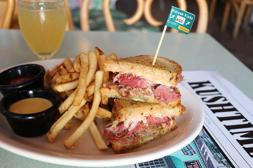 Pulled pork, corned beef, Swiss cheese, pickles, sauerkraut, yellow mustard and Russian dressing, served on grilled rye