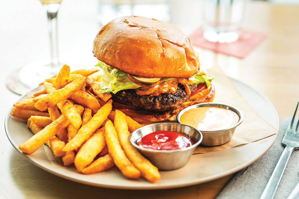 At New Belgium Brewing in San Francisco, the Mothership Burger boasts a cheese-stuffed Wagyu patty, served with tomato, caramelized beer onions and a slather of umami mayonnaise.