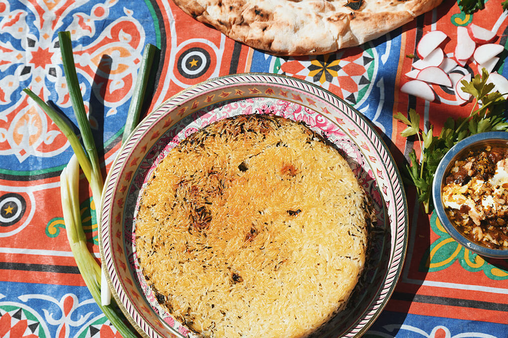 Tahdig takes center stage at Isfahan, a Persian pop-up in Chicago. Known for its crispy layer of rice, it’s featured on the menu in the Sabzi Polo with Tahdig, flavored with fresh herbs and saffron.