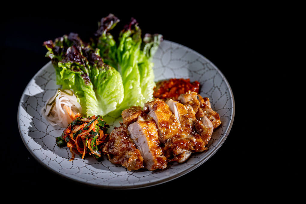 Abang Yoli, a Southeast and East Asian kitchen in Minneapolis’ Malcolm Yards, is one of nine vendors strategically chosen to deliver familiarity and intrigue, such as this Chicken Ssam with spicy gochujang.