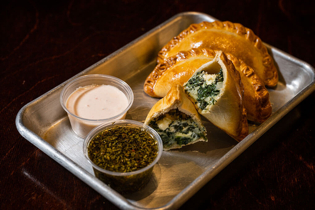 Argentinian street food is poised to break through, thanks in part to the narrow focus of food halls serving up easily translatable dishes like these handmade empanadas from DelSur Empanadas at Malcolm Yards in Minneapolis.