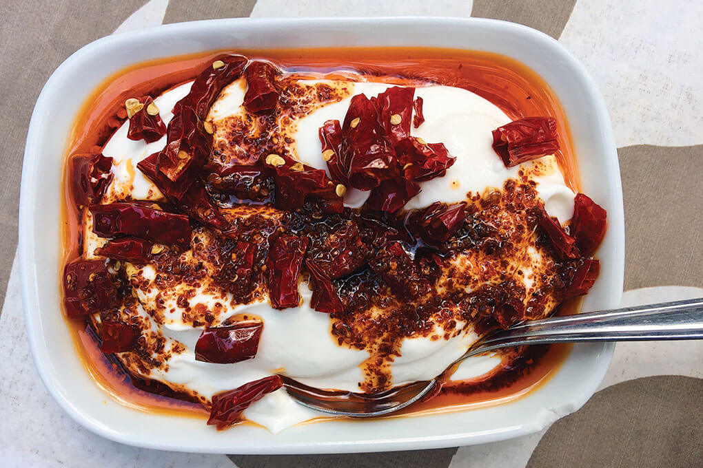Savory, smooth yogurt gets a blast of heat and a crunchy counterpoint with the colorful addition of chile crisp.