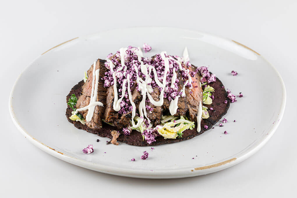 The Blueberry Mojo Steak Tacos, developed by Rosalyn Darling, feature tortillas made with blueberry concentrate, which adds dramatic color and a subtle sweetness.
