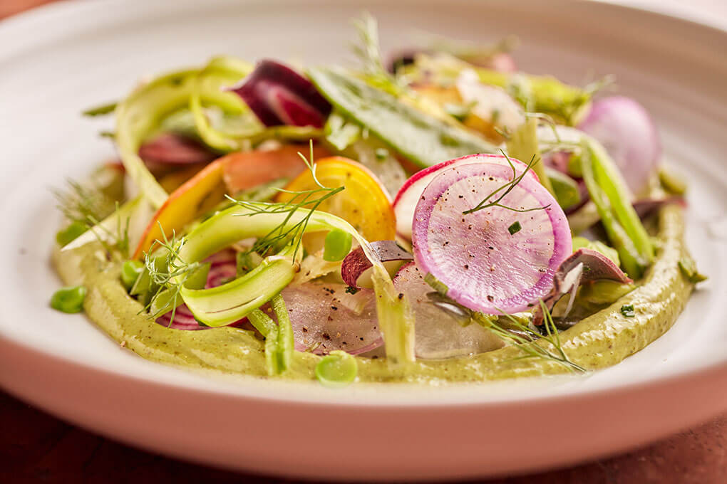 Rose Mary in Chicago features the Pinzimonio Salad, twisting Italy’s version of crudités into a knife-and-fork salad, served over a savory purée of bagna càuda.