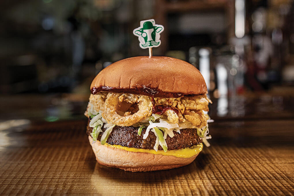 At Turkey and the Wolf in New Orleans, a plant-based burger gets a global-meets-the-American South spin with a guajillo barbecue sauce, fried onions and coleslaw.