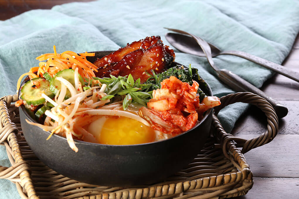 This Smoked Pork Belly Breakfast Bibimbap gets a briny counterpoint to the rich, smoky flavors with a Korean-style seaweed salad.