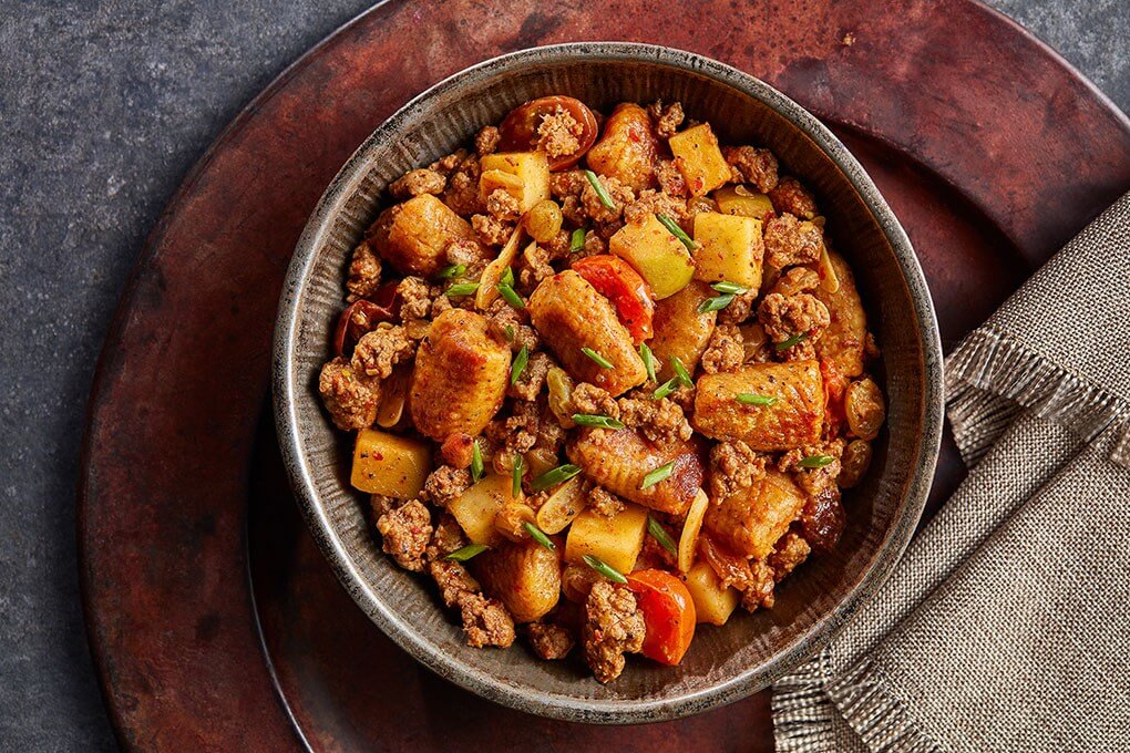 Baharat spices and harissa butter give this lamb and gnocchi dish a North African spin.