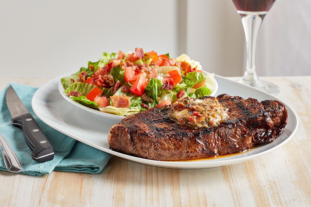 Debuting as one of the LTOs on Firebirds’ spring features menu, this wood-grilled New York strip is topped with a BLT butter and accompanied by the restaurant’s signature BLT Salad.