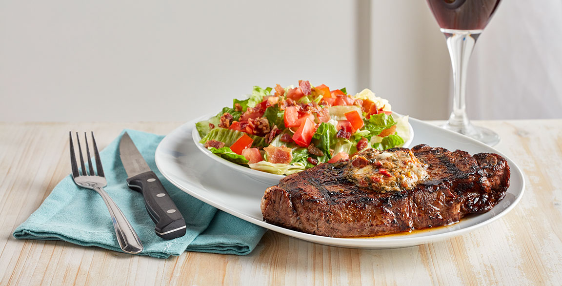 Debuting as one of the LTOs on Firebirds’ spring features menu, this wood-grilled New York strip is topped with a BLT butter and accompanied by the restaurant’s signature BLT Salad.