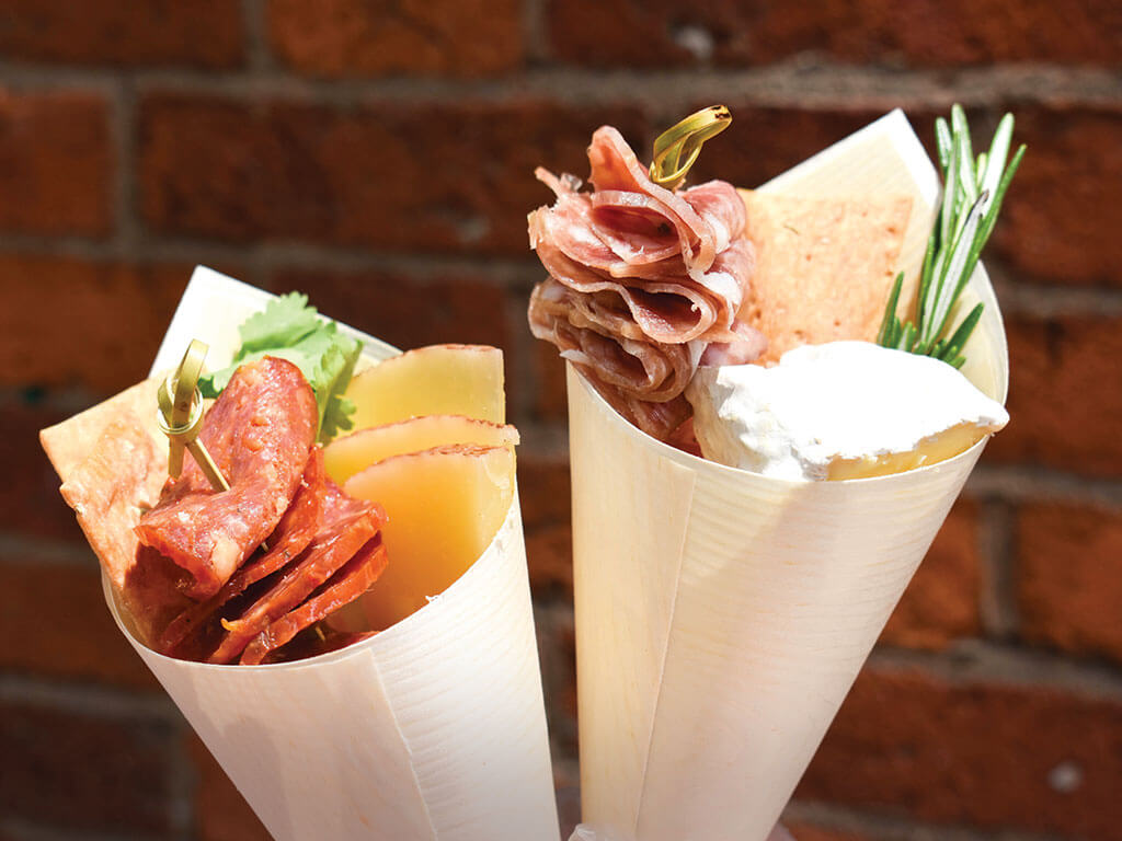 At Kured, a new quick-serve concept in Boston serving charcuterie, meat-and-cheese selections come in boxed and handheld formats, featuring curated and customizable options.