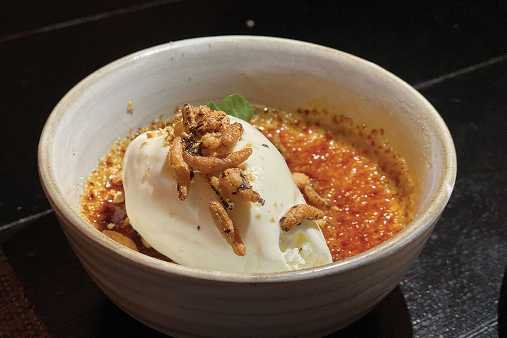Black Sheep in Las Vegas tops its Horchata Crème Brûlée with a scoop of vanilla bean ice cream and candied rice puffs.