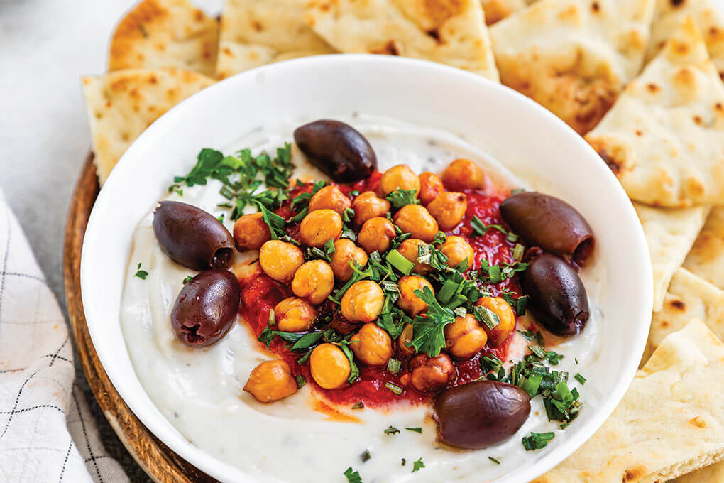  This Mediterranean Dip sees a blend of Boursin Dairy Free Cheese Spread Alternative, with coconut milk, then a topping of red pepper coulis and chickpeas, and a flourish of fresh herbs. The dairy-free product delivers all of the herbaceous flavor and creamy texture that Boursin is known for.