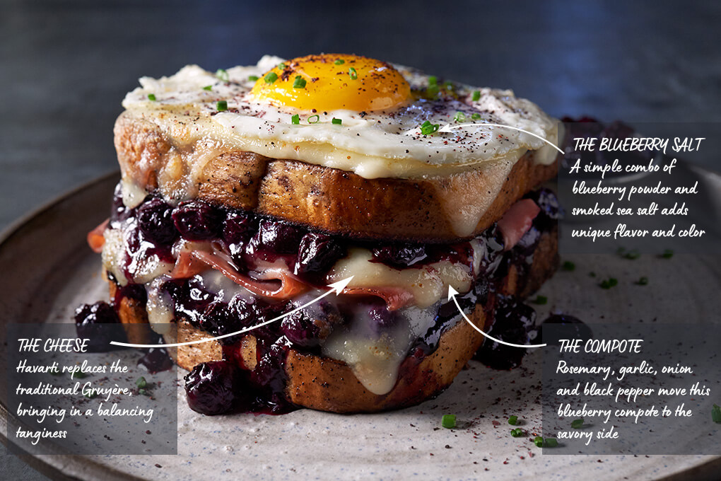 A simple combo of blueberry powder and smoked sea salt adds unique flavor and color; Havarti replaces the traditional Gruyère, bringing in a balancing tanginess; Rosemary, garlic, onion and black pepper move this blueberry compote to the savory side