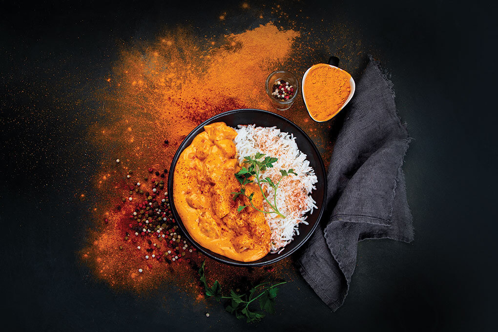 Thanks in large part to the warm, heady notes that are the hallmark of the spice blend garam masala, India’s classic butter chicken, as seen here, is moving into the mainstream, showing up in familiar menu items like tacos, loaded fries, and chicken and waffles.