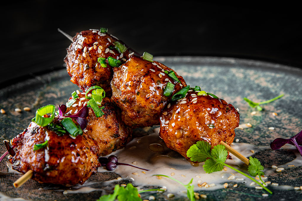 From the miso aïoli underneath to the sweet chile-honey glaze atop these deep-fried meatball skewers, sauces are the flavor drivers on modern menus.