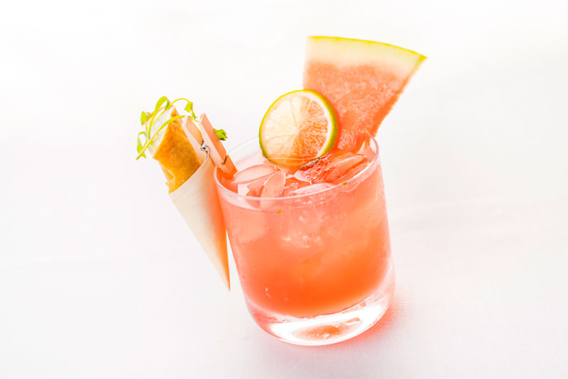 Natural Brands’ Baja Citrus Margarita featured mezcal and tequila, watermelon juice, Natural Brands Agave-Lime sour, and cilantro, garnished with a mini taquito clipped to the rim.