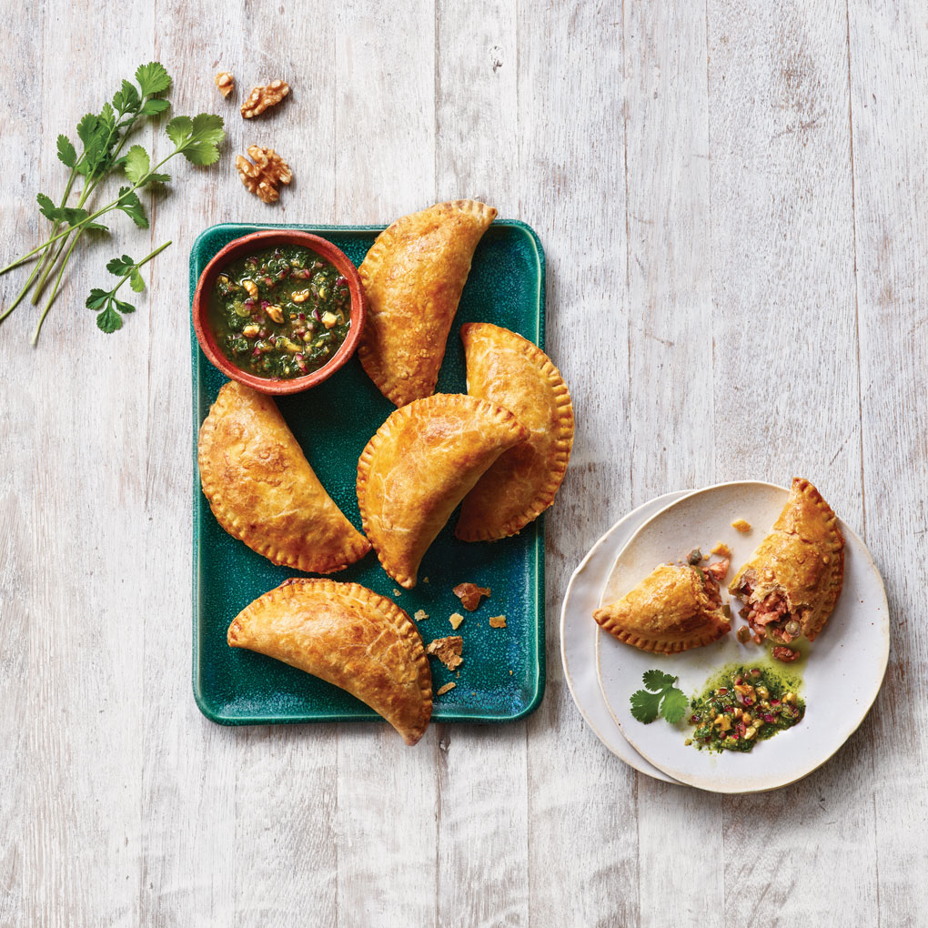 With these picadillo-style empanadas, a walnut filling gives the handheld a fresh, plant-forward makeover.