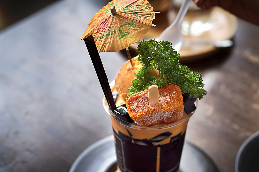 The Thai tea profile lends itself well to creative cocktail extensions, like this indulgent version, complete with a Thai tea popsicle.