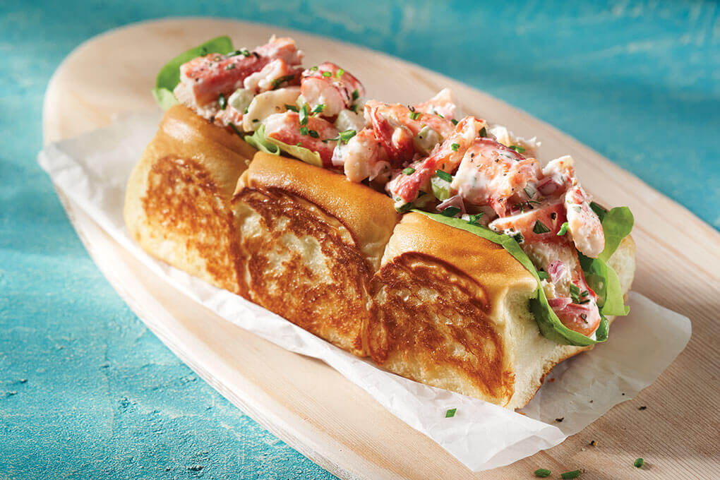 King Crab Sandwich on King’s Hawaiian Original Rolls. A unique way to manipulate the 24-Pack King’s Hawaiian Original Rolls — keep the three rolls connected and slice on the top side. This build gives the feel of a traditional lobster roll, but with a fun twist.