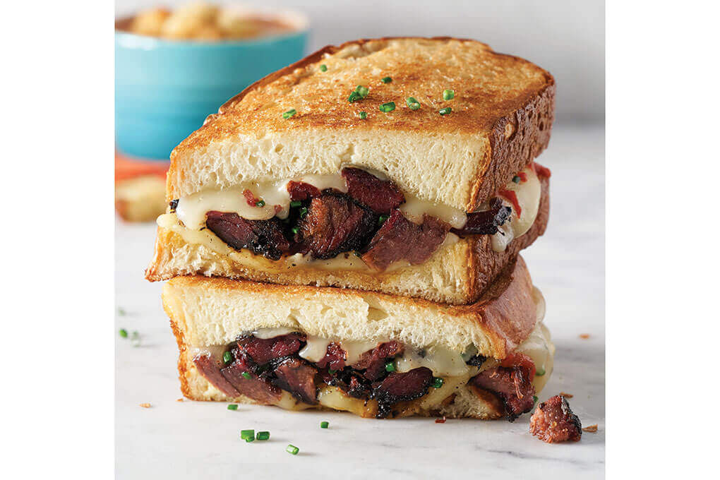 Burnt Ends Grilled Cheese on King’s Hawaiian Original Round Bread. The King’s Hawaiian Original Round Bread works great on the griddle and once it toasts it becomes golden brown, crispy and well textured. This should be any chefs go-to for a killer grilled cheese.