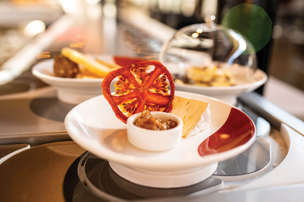 Culture + Co. in Nashville, Tenn., modernizes the charcuterie board by offering plates via a conveyor belt passing by diners.