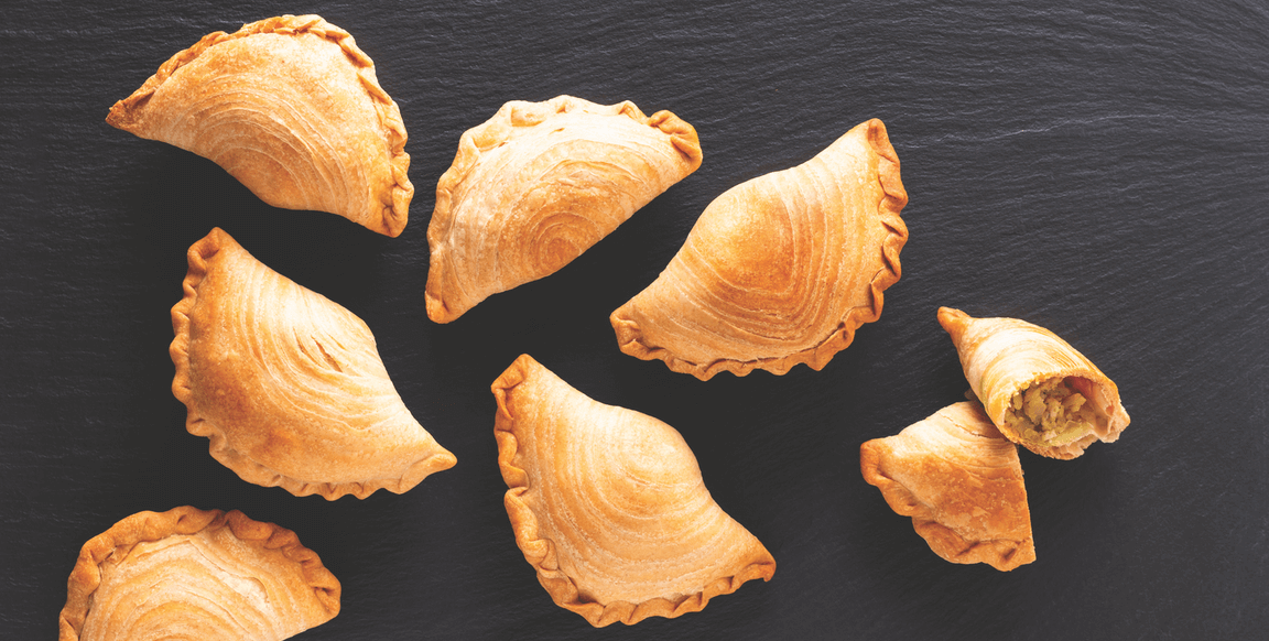 Southeast Asian curry puffs, typically filled with chicken and potato curry, are marked by flaky, laminated dough. Southeast Asian curry puffs, typically filled with chicken and potato curry, are marked by flaky, laminated dough.