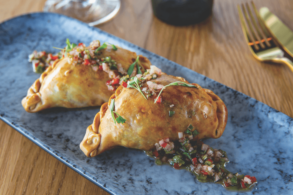 Chica taps into trending birria builds with its Wagyu Quesa-Birria Empanadas, served with a guajillo consommé.