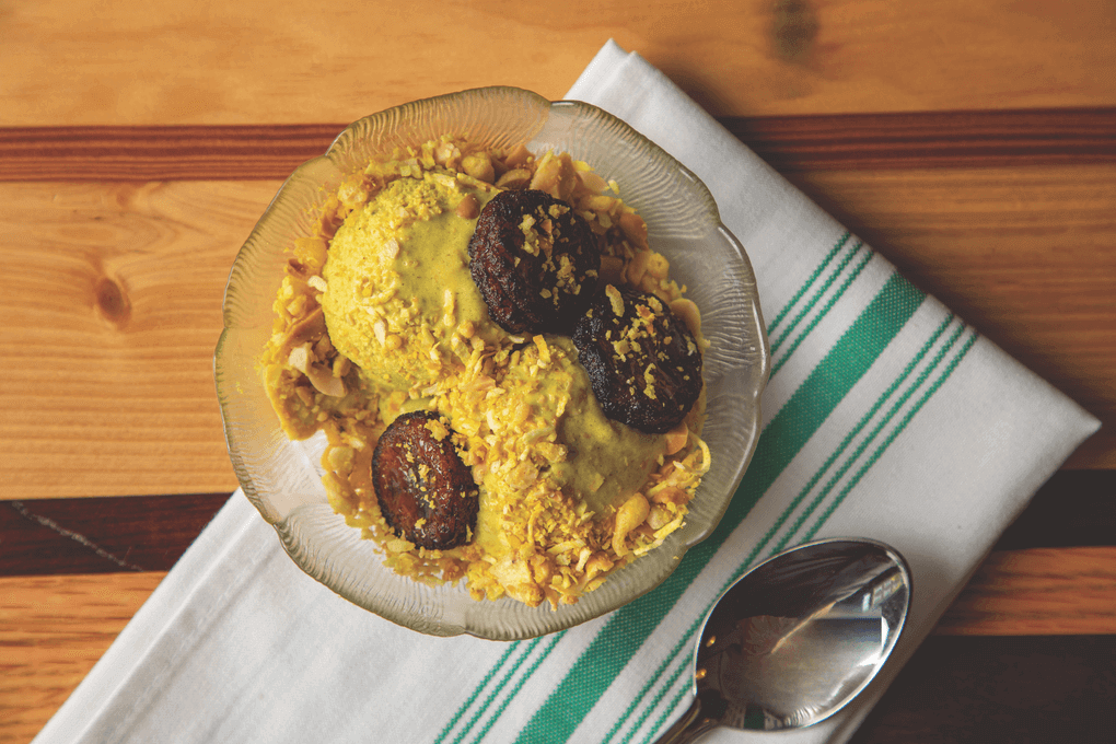 Palm & Pine’s Curry Banana Ice Cream blends sweet and savory with ripe bananas, rum and curry powder. The dessert is topped with brûléed banana slices and a crispy garnish of peanuts, coconut flake and boondi, an Indian fried chickpea flour snack.