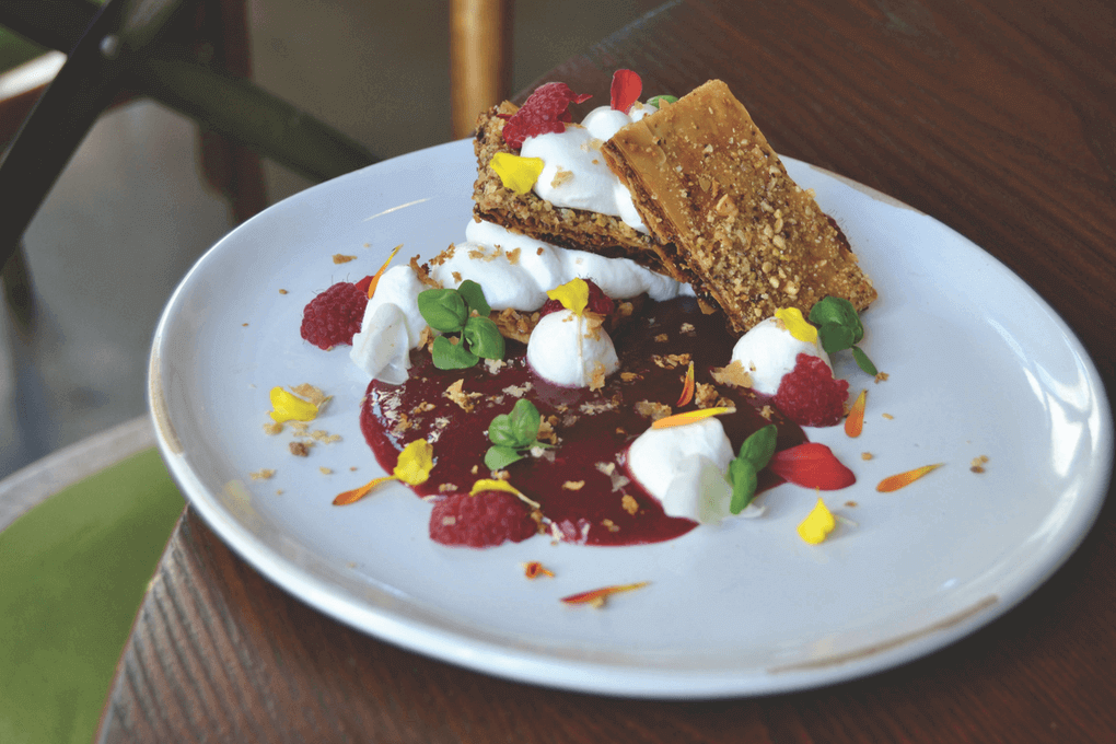 Baklava becomes crispy, sweet layers in a dessert build at Trade in Boston. The Baklava-Yogurt Napoleon is served with a cherry compote, berries and pistachios.
