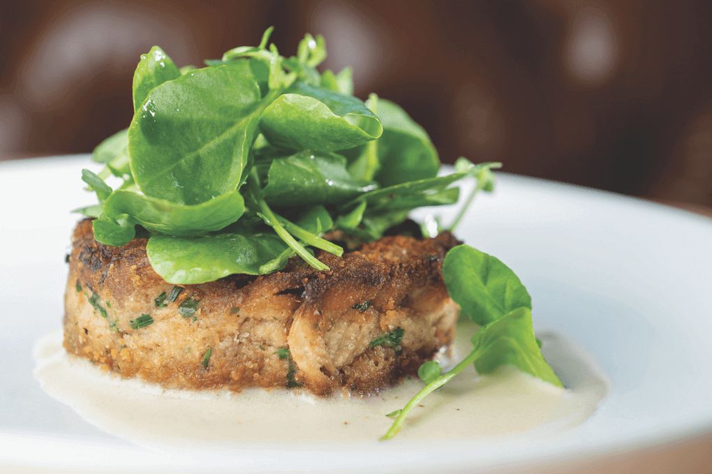 At Elm & Good in Dallas, the Lion’s Mane Mushroom Cake gets a hit of Old Bay seasoning to replicate classic crab cake flavors.