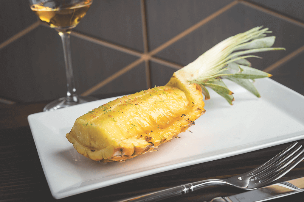 The simply elegant Brûléed Hawaiian Pineapple at New York’s Noreetuh features lime zest and alaea salt.