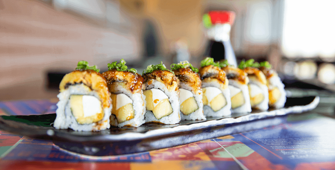 Blue Sushi Sake Grill’s Green Goddess (inset) uses spicy plant-based “tuna,” black tobiko “caviar” and ponzu sauce. Barbecued eggplant tempura stands in for eel in its South Pacific rolls, with vegan “cream cheese,” pineapple, scallion and a sweet soy sauce finishing the build.