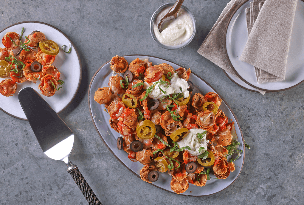 A clever way to leverage the red-hot pepperoni cup trend, this appetizer highlights the cups in a craveable favorite. The Cup N’ Char Pepperoni Nachos feature Margherita Cup N’ Char Pepperoni, dipped in hot sauce, dredged in flour and deep fried.