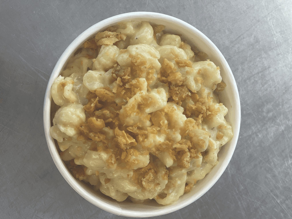 Crispy chicken skins serve as a salty, signature garnish on the Mac and Cheese at Kowbird in Oakland, Calif.