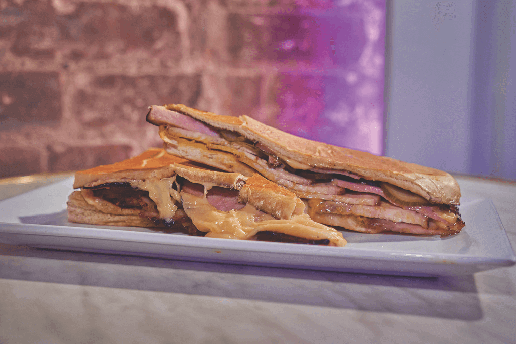 New York’s Sally Can Wait menus Latin-inspired handhelds with a Jewish twist. The Cubano sandwich features traditional ingredients like ham, Swiss cheese, pickles and mustard, then brings in pastrami-spiced pork shoulder.