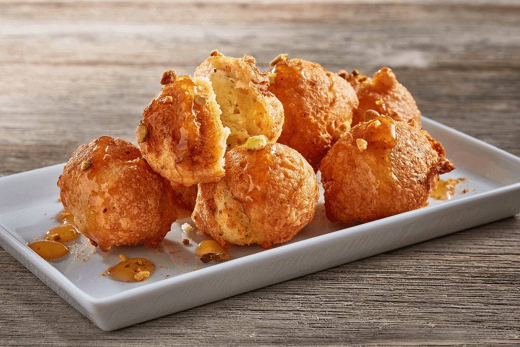 Boursin Black Pepper Beignets with Honey-Chile Glaze