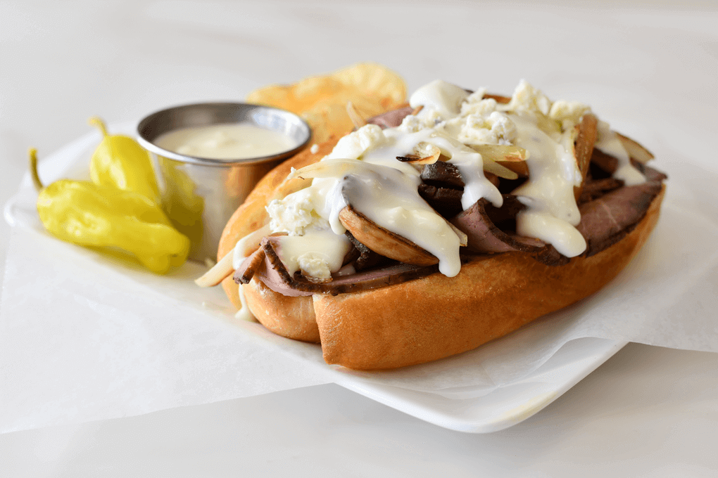 Photo caption: Queso topped with blue cheese crumbles makes this Beef & Blue Hoagie a showstopper. Get the recipe here.