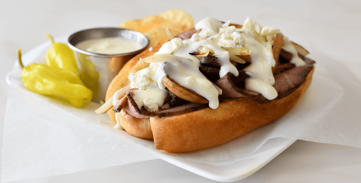 Photo caption: Queso topped with blue cheese crumbles makes this Beef & Blue Hoagie a showstopper. Get the recipe here.
