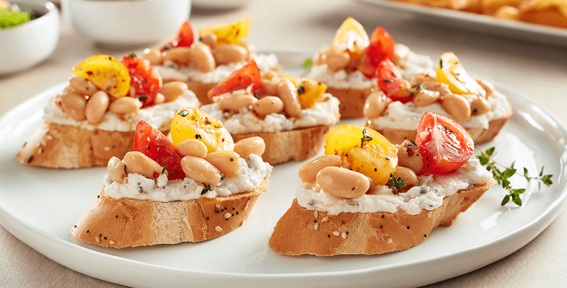 Boursin® Dairy-Free Cheese Spread Crostini with Cannellini Beans, Heirloom Tomatoes and Thyme