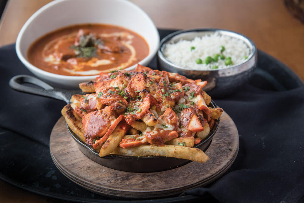 Combining different cultures in one ultra-craveable dish, Chauhan Ale & Masala House offers a Tandoori Chicken Poutine: tandoori chicken, makhani sauce, cheese curds and masala fries.