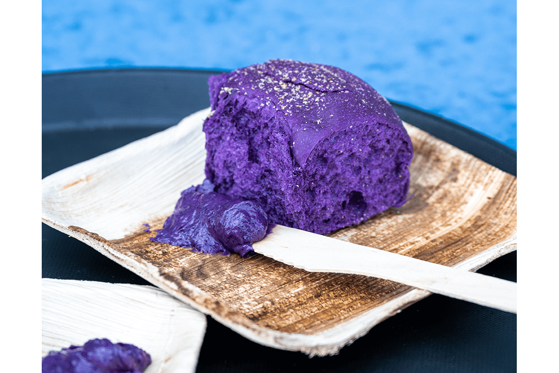 The Ube Pandesal Dinner Rolls at White Rice Bodega in San Diego are tender, slightly sweet and Crayon purple. Served warm, they carry the ube theme through with an accompanying ube butter.
