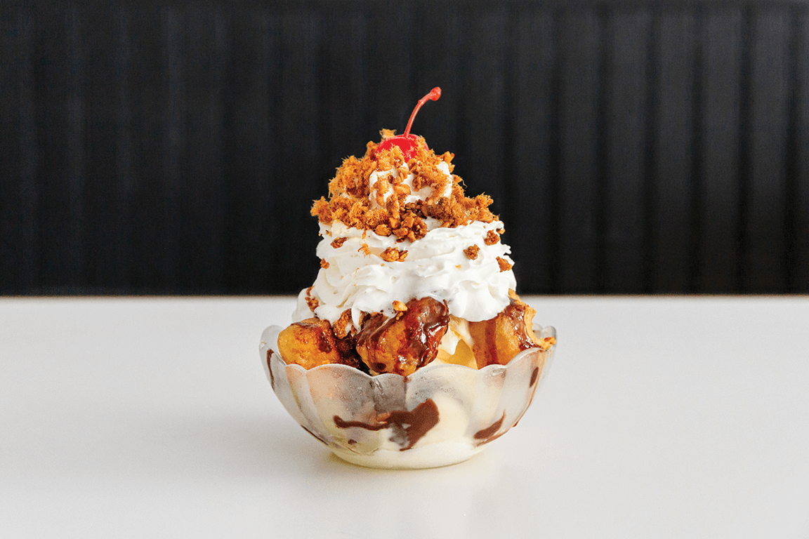 The Chow Nai Sundae at Bonnie’s in New York is a study in texture and temperature, demonstrating malted milk powder’s potential in creative menu play. The sundae features vanilla ice cream, fried malted milk, Ovaltine hot fudge and buttered nuts.