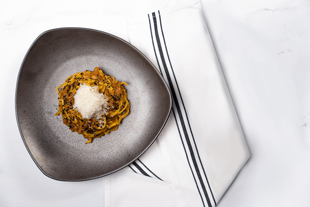For this Ramen Bolognese, Chef Robbie Felice infuses the classic sauce elements—beef, veal, pork and guanciale—with Asian flavor accents.