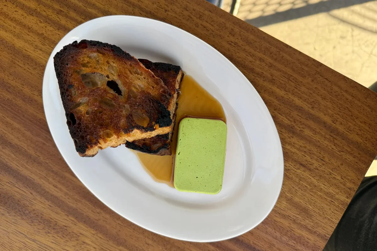 Sqirl’s new dinner menu features flavor-forward butters in a number of builds, including the Chicken Liver, served with celery compound butter, quince gastrique and housemade country bread